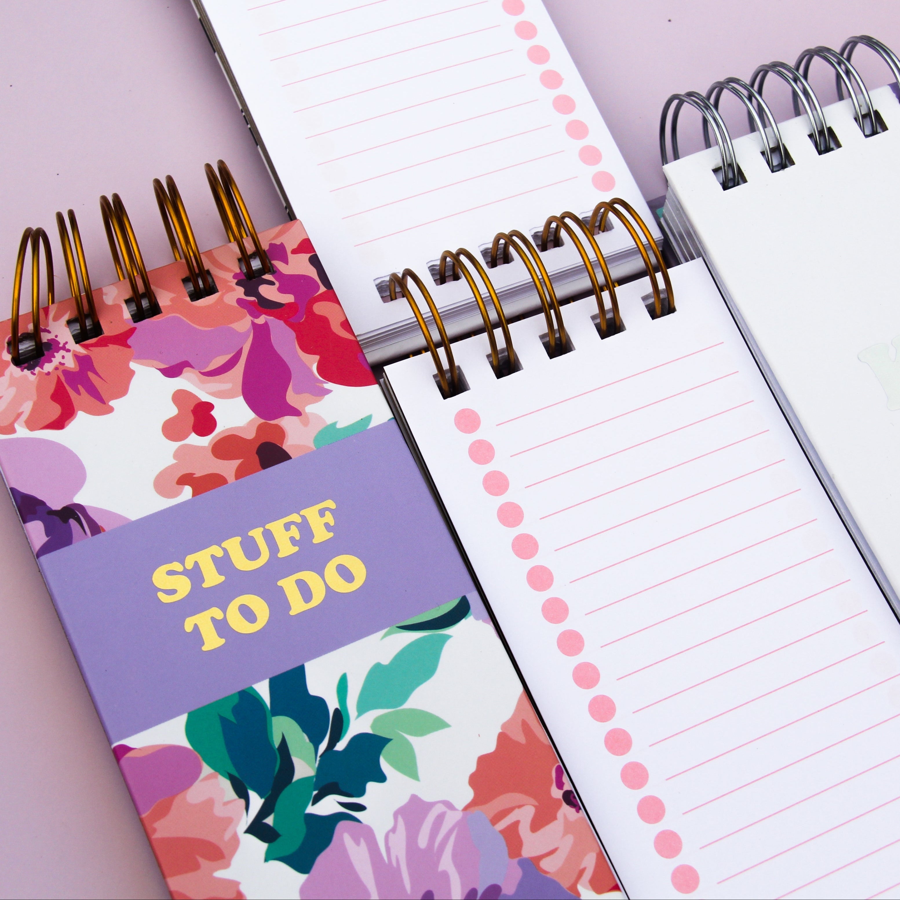 Notebook with floral cover and 'STUFF TO DO' text on a light purple background